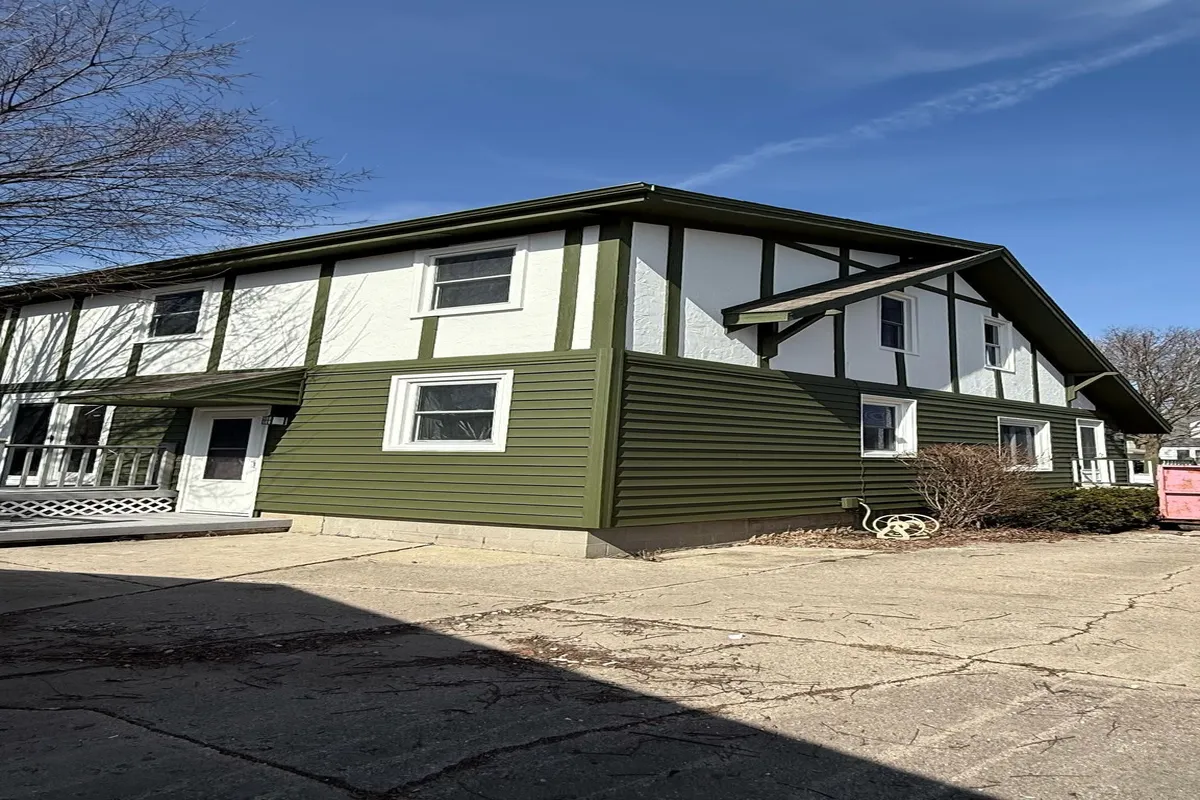 Home with dark green exterior siding paint