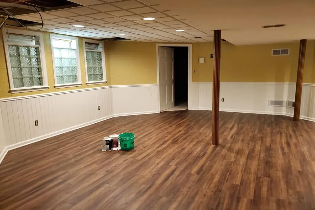 Large basement with yellow painted walls