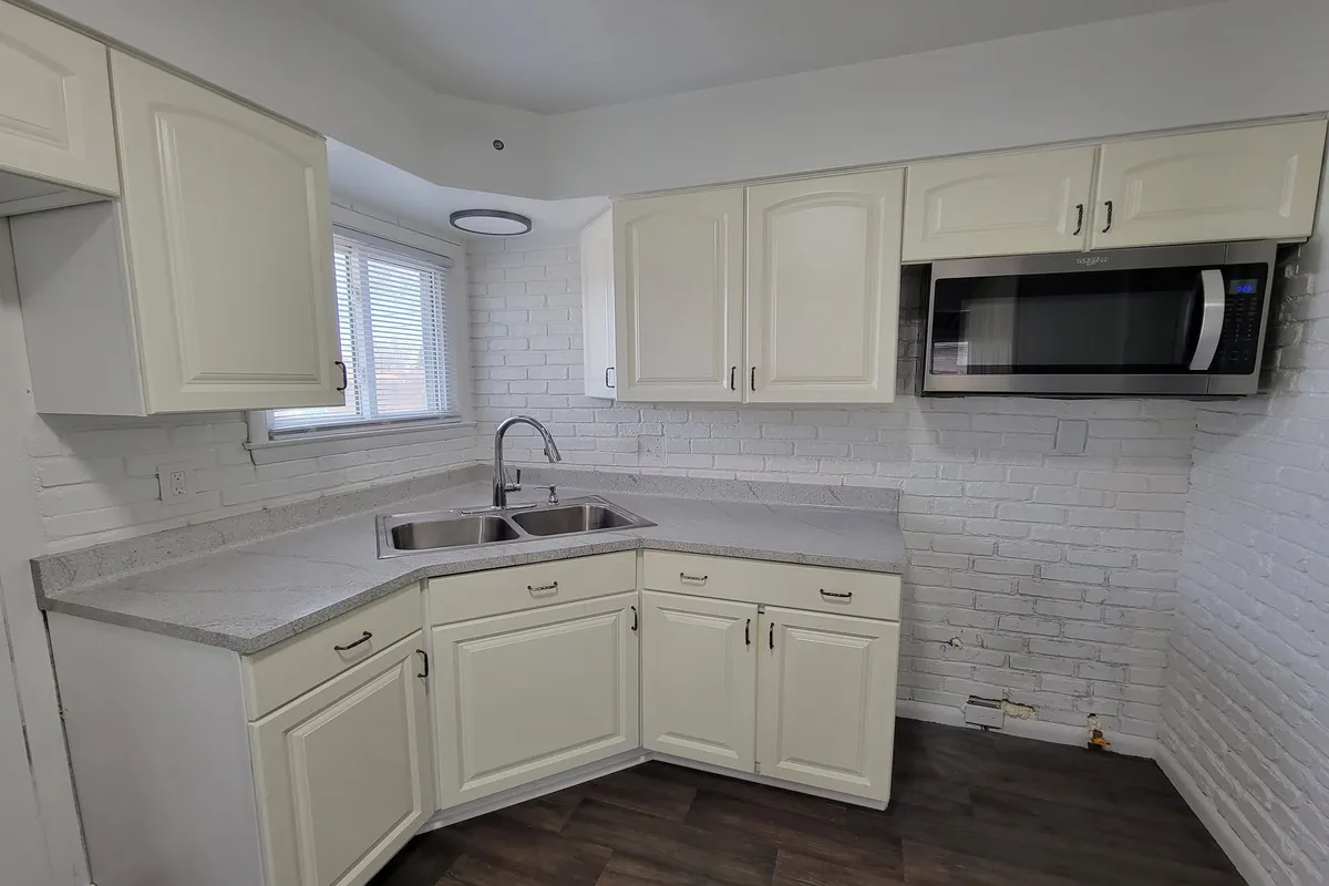 Kitchen with white painted cabinets